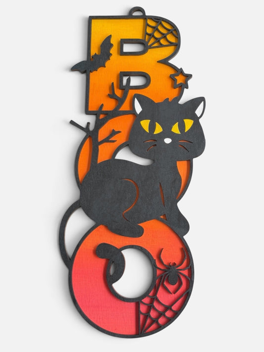 Halloween 'BOO' wall decor featuring a black cat silhouette sitting over orange and red gradient letters with spiderwebs, bats, and stars.